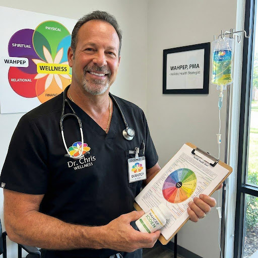 Dr. Chris at WAHPEP clinic with wellness tools